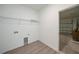 Laundry room with wire shelving, garage view, and wood look floors at 2138 Blaser St, Punta Gorda, FL 33980