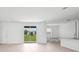 Open-concept living area with sliding glass doors leading to the backyard at 2138 Blaser St, Punta Gorda, FL 33980