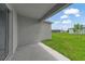 The home has a covered patio looking out onto the well-maintained lawn at 2138 Blaser St, Punta Gorda, FL 33980