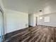 Modern living room showing spacious layout, wood-look flooring, and inviting design at 21899 Cellini Ave, Port Charlotte, FL 33952