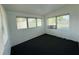 Carpeted bonus room with three windows providing plenty of natural light at 21899 Cellini Ave, Port Charlotte, FL 33952