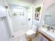 Modern bathroom with a glass-enclosed shower, vessel sink, and decorative wall niche for storage at 22334 Augusta Ave, Port Charlotte, FL 33952