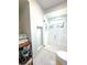 Bright bathroom featuring a glass shower, white subway tile, and decorative shelving nook at 22334 Augusta Ave, Port Charlotte, FL 33952