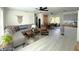 Spacious living room featuring modern furnishings, an open floor plan, and a ceiling fan at 22334 Augusta Ave, Port Charlotte, FL 33952