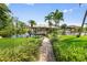 Waterfront backyard with boat dock and lush landscaping at 24398 Treasure Island Blvd, Punta Gorda, FL 33955