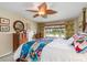 Bedroom has large windows with blinds, a ceiling fan and furniture at 24398 Treasure Island Blvd, Punta Gorda, FL 33955