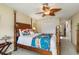 The bedroom has a decorative ceiling fan and access to the Primary bathroom at 24398 Treasure Island Blvd, Punta Gorda, FL 33955