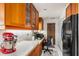 Cozy kitchen with stainless appliances, breakfast bar, and ample counter space at 24398 Treasure Island Blvd, Punta Gorda, FL 33955
