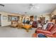 Expansive living area showcasing comfortable seating, natural light, and seamless flow to the dining space at 24398 Treasure Island Blvd, Punta Gorda, FL 33955
