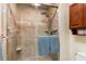 Beautiful tiled shower with glass doors and updated fixtures at 24398 Treasure Island Blvd, Punta Gorda, FL 33955