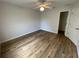 Spacious bedroom with wood floors and a closet, combining comfort and functionality at 2443 Lake View Blvd, Port Charlotte, FL 33948
