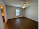 Bedroom featuring vinyl flooring, ceiling fan, window and neutral paint at 2443 Lake View Blvd, Port Charlotte, FL 33948