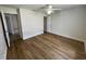 Bright bedroom with wood floors and a ceiling fan, offering comfort and style at 2443 Lake View Blvd, Port Charlotte, FL 33948