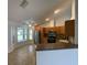 Modern kitchen with stainless steel appliances and breakfast bar at 2443 Lake View Blvd, Port Charlotte, FL 33948
