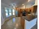 Modern kitchen featuring stainless steel appliances, ceiling fan, and breakfast bar at 2443 Lake View Blvd, Port Charlotte, FL 33948