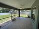 Screened lanai featuring tile flooring and views of the backyard at 2443 Lake View Blvd, Port Charlotte, FL 33948