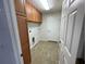 Functional laundry room with built-in cabinets, offering ample storage and convenience at 2443 Lake View Blvd, Port Charlotte, FL 33948
