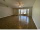 Bright living room with tile flooring, ceiling fan, and natural light at 2443 Lake View Blvd, Port Charlotte, FL 33948
