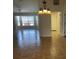 Living room with chandelier, tile flooring, and bright natural light at 2443 Lake View Blvd, Port Charlotte, FL 33948