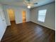 Primary bedroom boasts vinyl flooring, ensuite bathroom and a walk-in closet at 2443 Lake View Blvd, Port Charlotte, FL 33948