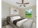 Bright bedroom with a large bed, neutral color scheme and a window view at 2461 Waller Rd, North Port, FL 34288