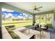 Relaxing screened-in porch with comfortable seating area and expansive views of the backyard at 2461 Waller Rd, North Port, FL 34288