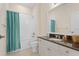 Bright bathroom featuring a vanity, toilet and shower/tub combo with a tiled shower at 25555 Heritage Lake Blvd # 27, Punta Gorda, FL 33983