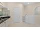 Bright bathroom featuring a walk-in tub and granite countertop vanity at 25555 Heritage Lake Blvd # 27, Punta Gorda, FL 33983