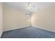 Neutral colored bedroom with plush carpet, ceiling fan and light colored walls at 25555 Heritage Lake Blvd # 27, Punta Gorda, FL 33983