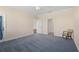 Spacious bedroom with blue carpet, neutral walls, with ensuite access and ceiling fan for added comfort at 25555 Heritage Lake Blvd # 27, Punta Gorda, FL 33983