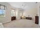 Spacious bedroom with multiple windows, neutral carpet and ceilings with crown molding and a ceiling fan at 25555 Heritage Lake Blvd # 27, Punta Gorda, FL 33983
