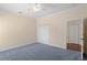 Bedroom featuring neutral colored walls, carpet, closet doors and a ceiling fan at 25555 Heritage Lake Blvd # 27, Punta Gorda, FL 33983
