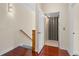 Hallway with hardwood floors leading to an elevator, offering accessibility and convenience at 25555 Heritage Lake Blvd # 27, Punta Gorda, FL 33983