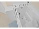 Close-up of a walk-in tub with a handheld shower head at 25555 Heritage Lake Blvd # 27, Punta Gorda, FL 33983