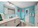 Bathroom features flamingo decor, granite vanity, and outdoor access at 26125 Copiapo Cir, Punta Gorda, FL 33983