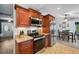 Beautiful kitchen with granite countertops, stainless steel appliances, and rich wood cabinets at 26125 Copiapo Cir, Punta Gorda, FL 33983
