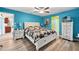 Spacious main bedroom with a calming atmosphere, wood floors, and coordinating furniture at 26125 Copiapo Cir, Punta Gorda, FL 33983