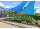 Backyard pond with fountains, lily pads, and shaded coverings at 26125 Copiapo Cir, Punta Gorda, FL 33983