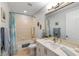 Bathroom featuring a shower-tub combination, a large mirror and a white vanity with sink at 2630 Tarpon Cove Dr # 212, Punta Gorda, FL 33950