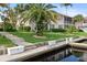 Condo overlooking waterfront with lush green yard and boat dock at 2630 Tarpon Cove Dr # 212, Punta Gorda, FL 33950
