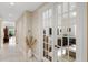 Hallway with tile flooring and an office featuring French doors and an organized desk with a comfortable chair at 2630 Tarpon Cove Dr # 212, Punta Gorda, FL 33950