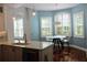 Charming kitchen nook featuring pendant lighting, quartz countertops, and stainless steel appliances at 2630 Tarpon Cove Dr # 212, Punta Gorda, FL 33950