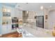 Modern kitchen featuring white cabinets, quartz countertops, stainless steel appliances, and stylish pendant lighting at 2630 Tarpon Cove Dr # 212, Punta Gorda, FL 33950