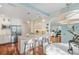 Open-concept kitchen with stainless appliances, large island with seating, and an adjacent living area at 2630 Tarpon Cove Dr # 212, Punta Gorda, FL 33950