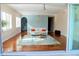 Bright living room with hardwood floors, modern decor, and sliding glass doors for indoor-outdoor living at 2630 Tarpon Cove Dr # 212, Punta Gorda, FL 33950
