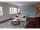 Comfortable living room with hardwood floors, stylish furnishings, and large windows for natural light at 2630 Tarpon Cove Dr # 212, Punta Gorda, FL 33950