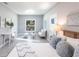 Spacious bedroom with stylish furnishings, neutral tones, and ample natural light for a relaxing retreat at 278 Akers St, Port Charlotte, FL 33953