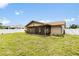 The home has a sizable yard and a screened-in patio at 3242 Nocturne Rd, Venice, FL 34293