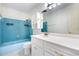 This bathroom offers ample storage with a built-in cabinet, shower and tub, and updated vanity at 3242 Nocturne Rd, Venice, FL 34293