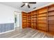 Bedroom showcasing custom built-in bookshelves that provide a unique feature for organization and charm at 3242 Nocturne Rd, Venice, FL 34293